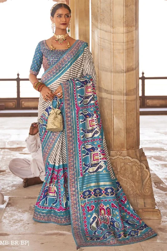 Patola Silk Fabric Function Wear Printed Luxurious Saree With Semi Stitched Blouse In Cyan Color Ruffled Neck Blouse Patola Silk Fabric Function Wear Printed Luxurious Saree With Semi Stitched Blouse In Cyan Color Ruffled Neck Blouse