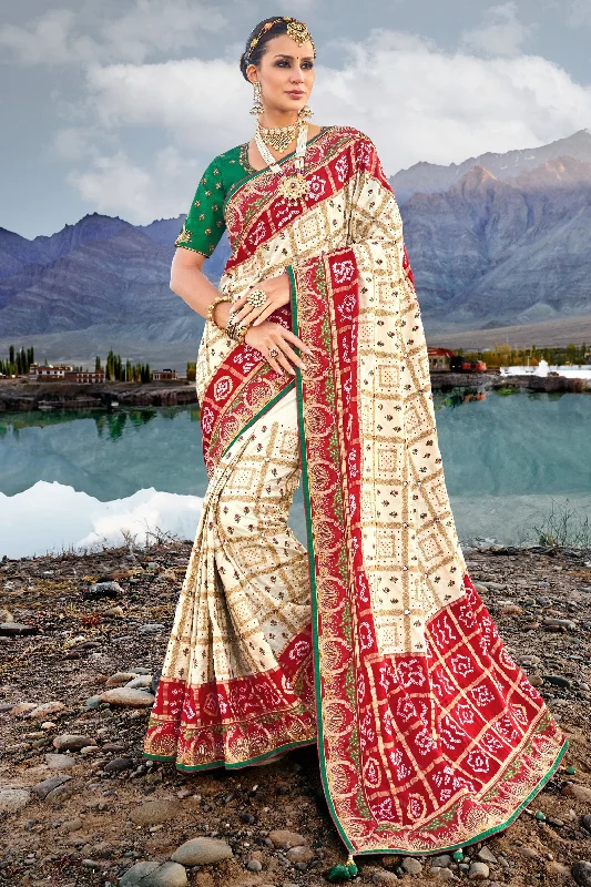 Appealing Pure Gajji Bandhani Satin Cream Color Saree With Heavy Embroidered Silk Blouse Double Button Blouse
