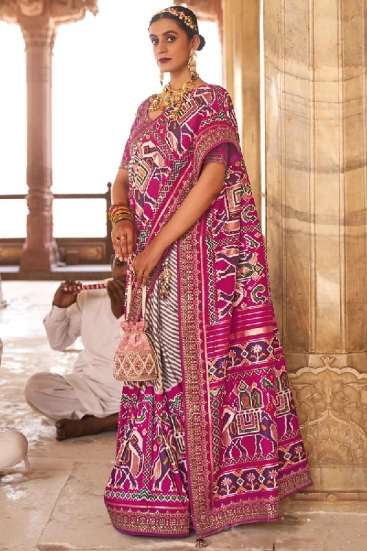 Patola Silk Fabric Printed Function Wear Mesmeric Saree With Semi Stitched Blouse In Rani Color Satin Long Blouse