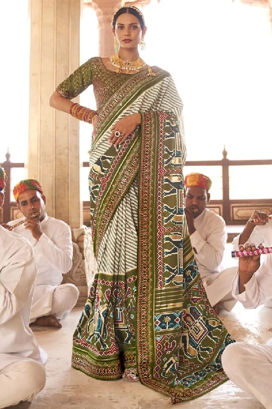 Patola Silk Fabric Function Wear Mehendi Green Color Printed Phenomenal Saree With Semi Stitched Blouse Cotton Casual Blouse Patola Silk Fabric Function Wear Mehendi Green Color Printed Phenomenal Saree With Semi Stitched Blouse Cotton Casual Blouse