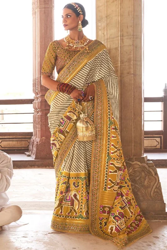 Yellow Color Patola Silk Fabric Function Wear Printed Miraculous Saree With Semi Stitched Blouse Slim Fit Blouse Yellow Color Patola Silk Fabric Function Wear Printed Miraculous Saree With Semi Stitched Blouse Slim Fit Blouse