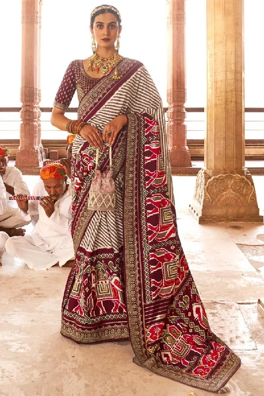 Maroon Color Patola Silk Fabric Printed Function Wear Luminous Saree With Semi Stitched Blouse Peter Pan Blouse Maroon Color Patola Silk Fabric Printed Function Wear Luminous Saree With Semi Stitched Blouse Peter Pan Blouse